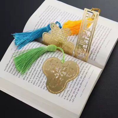 Gold and silver etched metal bookmarks with 3D enamel designs