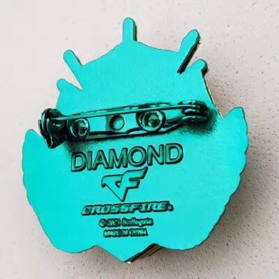 Unique Green Metal Badge with Rhinestone Accents