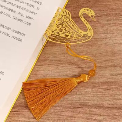 Antique-style gold metal bookmark with hollow design and elegant cutouts