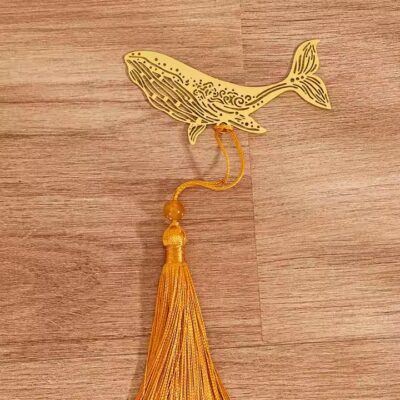 Antique-style gold metal bookmark with hollow design and elegant cutouts