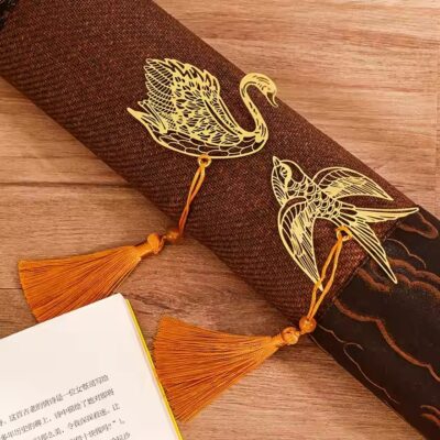 Antique-style gold metal bookmark with hollow design and elegant cutouts