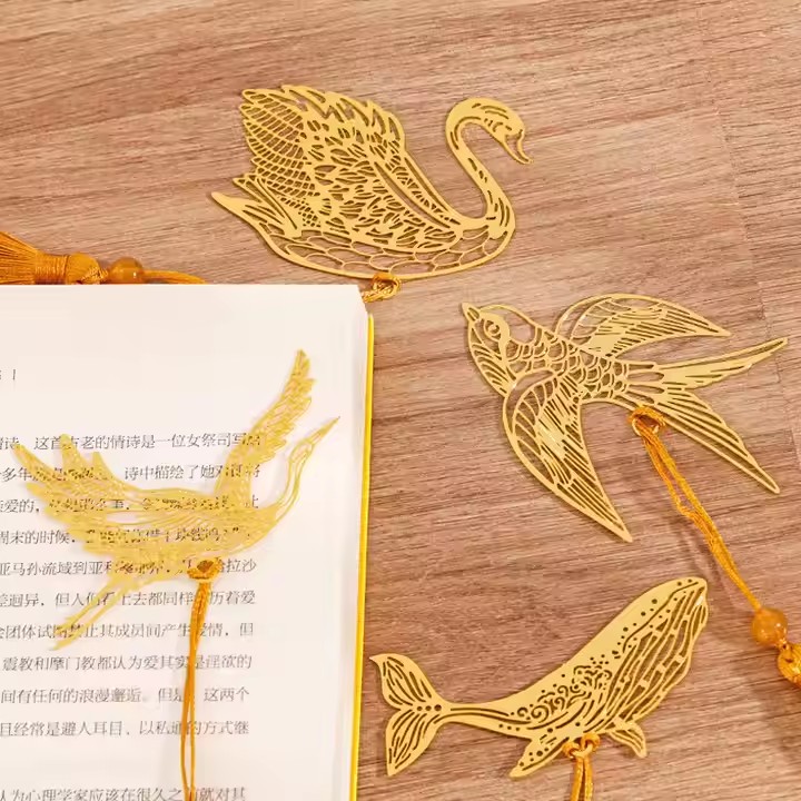 Antique-style gold metal bookmark with hollow design and elegant cutouts