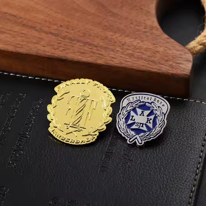 Custom gold and silver embossed metal badge with intricate texture