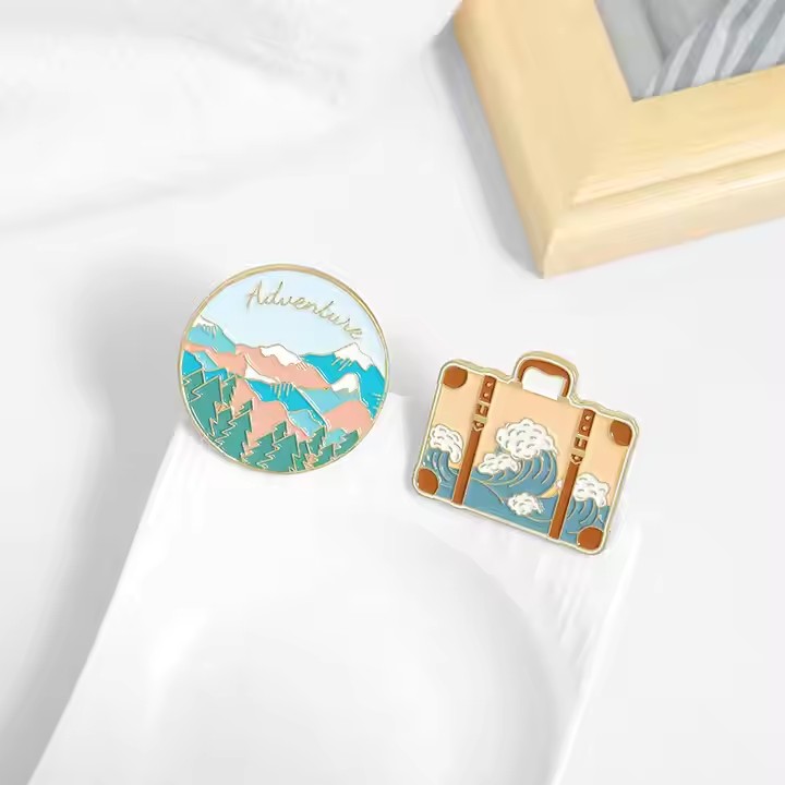 New travel adventure enamel metal pin with vibrant colors and detailed design