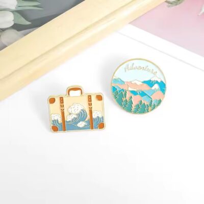 New travel adventure enamel metal pin with vibrant colors and detailed design