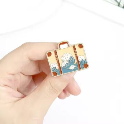 New travel adventure enamel metal pin with vibrant colors and detailed design